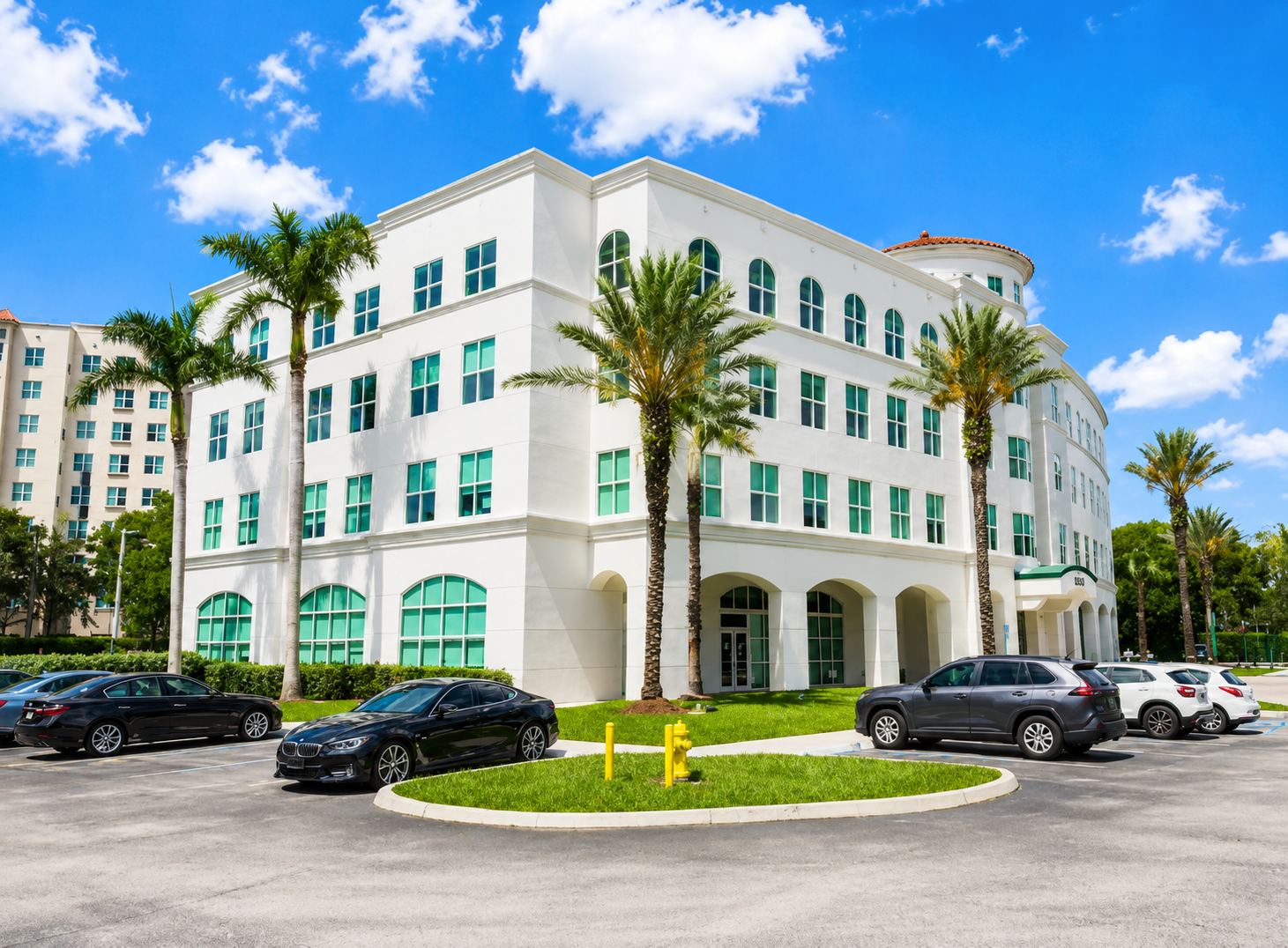 Doral Office Plaza exterior building with palm-lined parking